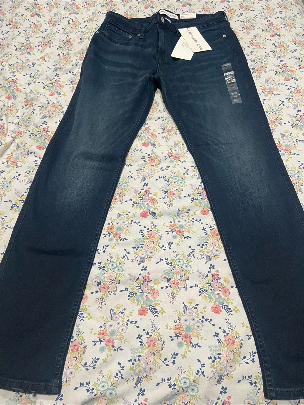 Calvin Klein men's jeans in a dark wash denim.